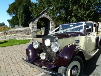 Rolls Royce Wedding car Hire on wedding day infront of arch